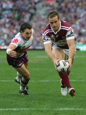 Manly memories: Michael Robertson scores in the 2008 grand final win over Melbourne.