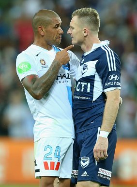 Angry men: Patrick Kisnorbo of City and Besart Berisha of Victory exchange words after the game on Saturday night.