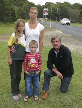Caged in: Lindy Hudson with her children Emily and Tom, and deputy mayor of Eurobodalla Shire Council Rob Pollock,