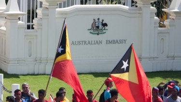 Protesters assembled outside the gates of the Australian embassy in Dili in February, demanding negotiations over the Timor Sea boundary.