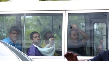 Injured asylum seekers arrive at hospital after the Manus riot.
