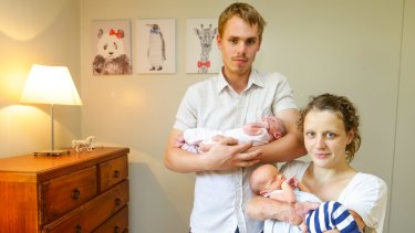 Danielle Weymark with her partner Mathew Johnson and their newborn twins, Lara Weymark-Johnson and Oliver Weymark-Johnson. Danielle survived meningitis as a baby and now warns parents of its dangers.