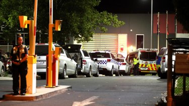 Police vehicles at Melbourne Youth Justice Centre in Parkville late on Saturday night.