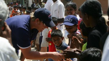 Shane Warne visiting a tsunami refugee camp in southern Sri Lanka in 2005. The Shane Warne Foundation donated money to the aid effort. 