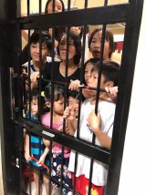 Women and children, including Tran Thi Thanh Loan (centre), in their cell at the detention centre.
