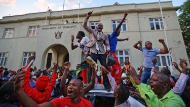 Celebrations outside the parliament building in downtown Harare, Zimbabwe after Mugabe resigned.