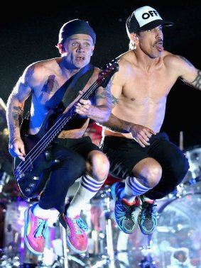Devastated: Band bassist Flea (left) addressed the crowd after the concert was cancelled. 