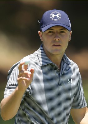 Jordan Spieth of the USA acknowledges the crowd.