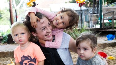 Childcare worker, Lucy Gosling, with kids, (L-R) Gabriel, Etta and Jemima, at the Clovelly Child Care Centre.