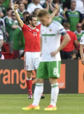 Historic triumph: Gareth Bale celebrates after the final siren.