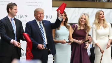 Republican presidential candidate Donald Trump with his family at the grand opening of Trump International Hotel in Washington.