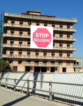 Stalled progress: the St Georges Hotel, on Beirut's Corniche, with its protest banner against Solidere.