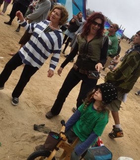 Tilda Vassallo rocking out at a previous Rainbow Serpent Festival with daughter-in-law Michelle and grandson Kaelan.