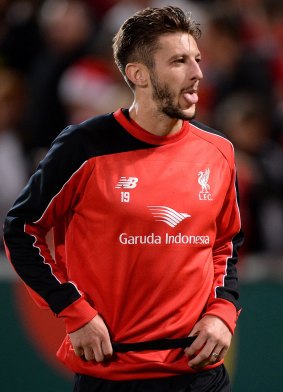 Adam Lallana greets fans during a Liverpool FC training session at Suncorp Stadium.