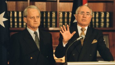 Mr Ruddock, as immigration minister, and with then prime minister John Howard.
