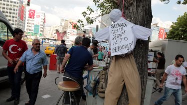 People pass by an effigy of Fethullah Gulen in Ankara, Turkey.