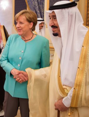 German Chancellor Angela Merkel with King Salman in Saudi Arabia, when her uncovered hair garnered headlines.