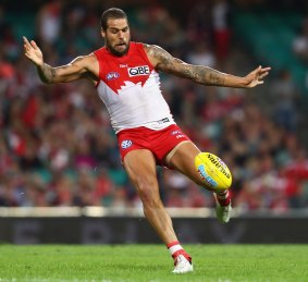 Another one through the big sticks: Lance Franklin kicks a goal against Essendon on Saturday night.
