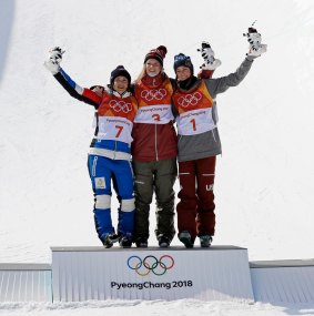 From left, silver medal winner, Marie Martinod, of France, gold medal winner, Cassie Sharpe, of Canada, and bronze medal winner, Brita Sigourney, of the United States, celebrate after the women's halfpipe final at Phoenix Snow Park.