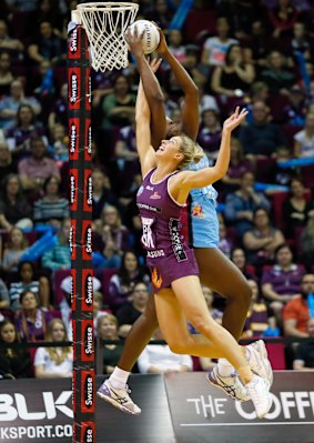 Firebirds' Laura Geitz competes for the ball with Jhaniele Fowler-Reid.