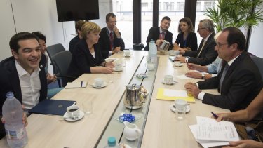 Greek Prime Minister Alexis Tsipras (left), German Chancellor Angela Merkel (second left), European Commission President Jean-Claude Juncker (second right) and French President Francois Hollande (right).