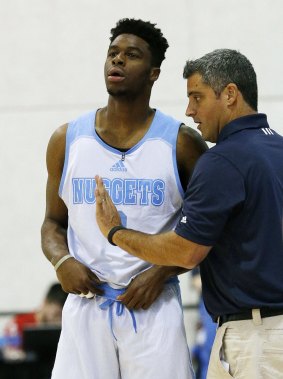 Talking tactics: Denver Nuggets playmaker Emmanuel Mudiay gets some instructions before checking in to a game at NBA Summer League.