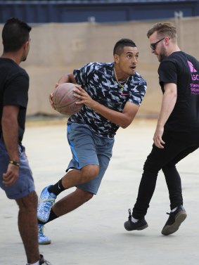 A different court: Australian tennis star Nick Kyrgios helps launch the Westside precinct at Acton Park with a celebrity basketball game on Tuesday.
