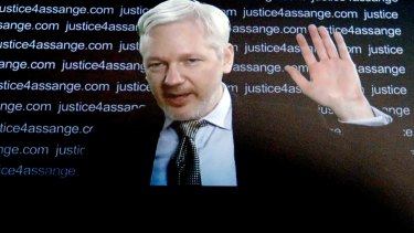 WikiLeaks founder Julian Assange addresses the media   via video link on Friday. 