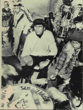 Dennis Banks (centre), leader of the American Indian Movement, participates in a ceremony in 1975. 