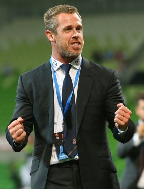Newcastle Jets coach Scott Miller shows his joy after his team came back to win.