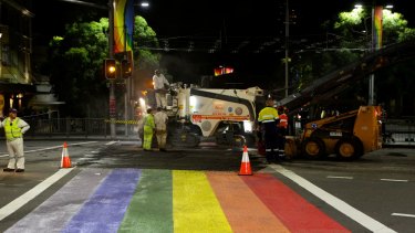 Roadworkers rip up the rainbow crossing in Oxford Street at Taylor Square on April 10, 2013.