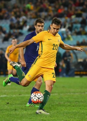 Trent Sainsbury of the Socceroos attempts a shot at goal during the international friendly match between the Australian Socceroos and Greece at ANZ Stadium in June, 