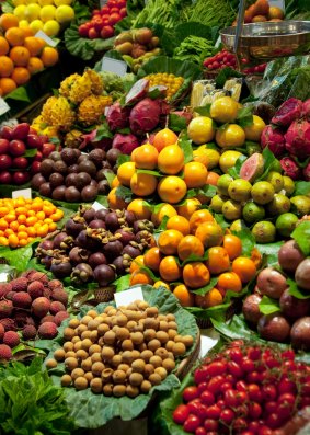 Exotic fruits and vegetables can be found on the market stalls of the famous Boqueria Market in Barcelona.