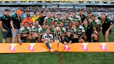 Champions:  The Jets celebrate with the winners trophy after the 2015 State Championship Grand Final.