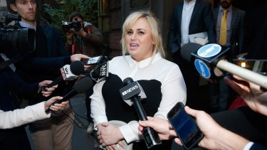 Rebel Wilson talks to the media outside the Supreme Court on Tuesday.
