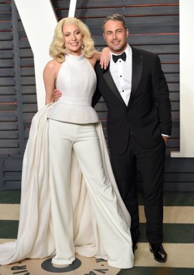 Lady Gaga and Taylor Kinney attend the 2016 Vanity Fair Oscar Party on February 28, 2016 in Beverly Hills, California.