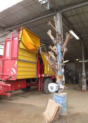 A sculpture of homemade rockets fired from the Gaza Strip in the machinery shed at Kibbutz Ein HaShlosha.