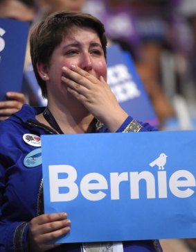 A supporter cries while listening to Senator Bernie Sanders speak.