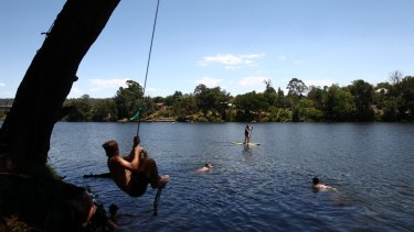 Penrith residents seeking refuge in the Nepean River during scorching weather of 47.3 degrees on Sunday. 