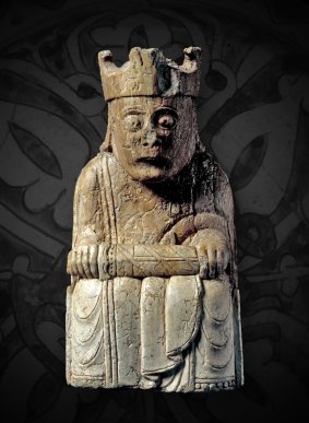 A figure of a king, likely a chess piece.