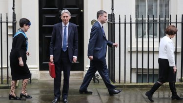 Baroness Neville-Rolfe, David Gauke MP, Chancellor of the Exchequer Philip Hammond MP and Jane Ellison MP leave 11 Downing Street in London.