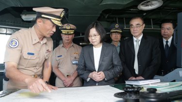 Taiwan's President Tsai Ing-wen (centre) reviews nautical charts aboard a Taiwan Navy ship. A new book claims Taiwan and China are the real Asian flashpoint, not North Korea.