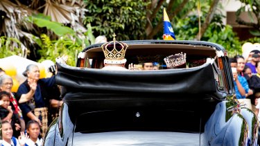 King Tupou VI and Queen Nanasipau'u head to the royal palace after the coronation ceremony.