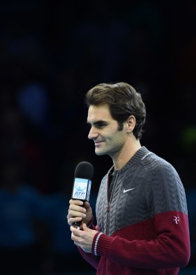 Injured: Roger Federer apologises to the crowd for having to withdraw from the final.