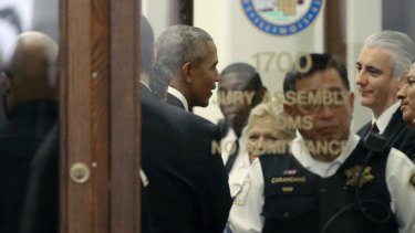 Former president Barack Obama arrives for jury duty in the Daley Centre in Chicago.