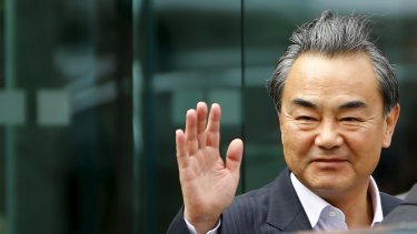 Chinese Foreign Minister Wang Yi gestures on Monday as he leaves Palais Coburg, the venue for nuclear talks in Vienna.
