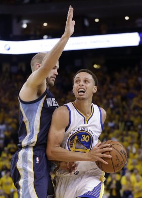Money man: Golden State Warriors guard Stephen Curry drives against Memphis Grizzlies opponent Nick Calathes. The Warriors won 101-86.