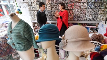 Aron Lewin, left, founder of the website Tales of Brick and Mortar, about older Melbourne shops, with Jenny Stefos, proprietor of The Brighton Button Shop. 