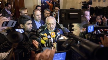 Iranian Foreign Minister Mohammad Javad Zarif, centre, speaks after meetings with the German and French foreign ministers in Lausanne, Switzerland on Saturday.