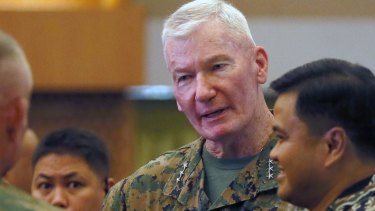 Lt. Gen. John Toolan, US Commander of US Marine forces in the Pacific, chats with Vice-Admiral Alexander Lopez, right, following the opening ceremony of their annual joint military exercise, dubbed Balikatan 2016.